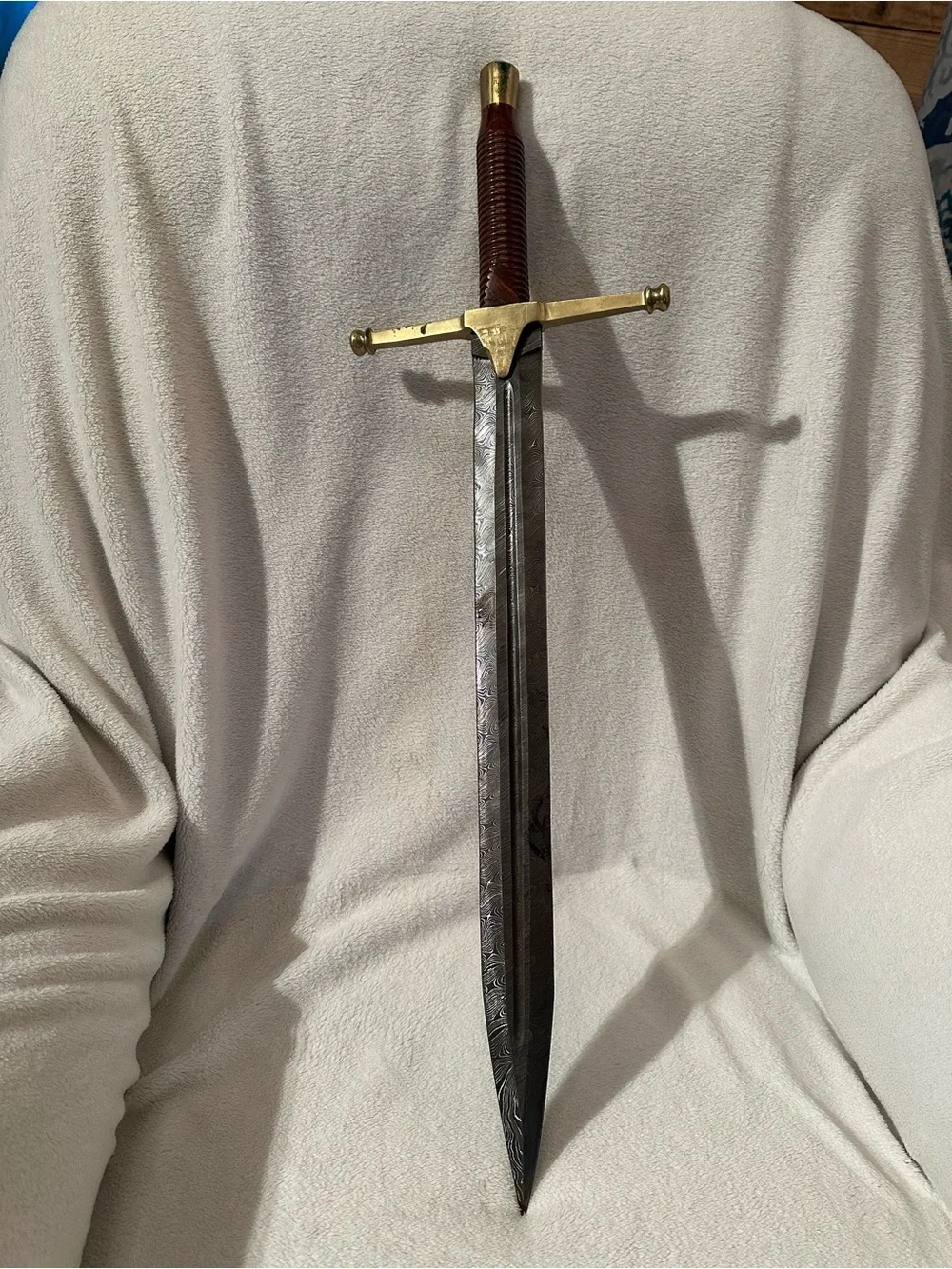 Damascus Rhindon Sword. Comes with yellow sheath.